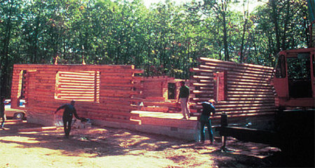 Pre-Assembled Log Walls Being Erected